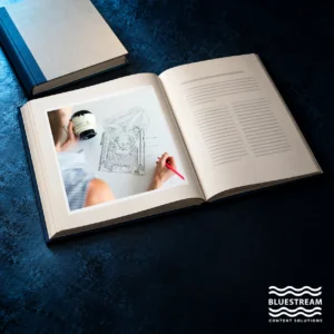 An open catalogue displays a real engineering photograph beside a companion service manual.